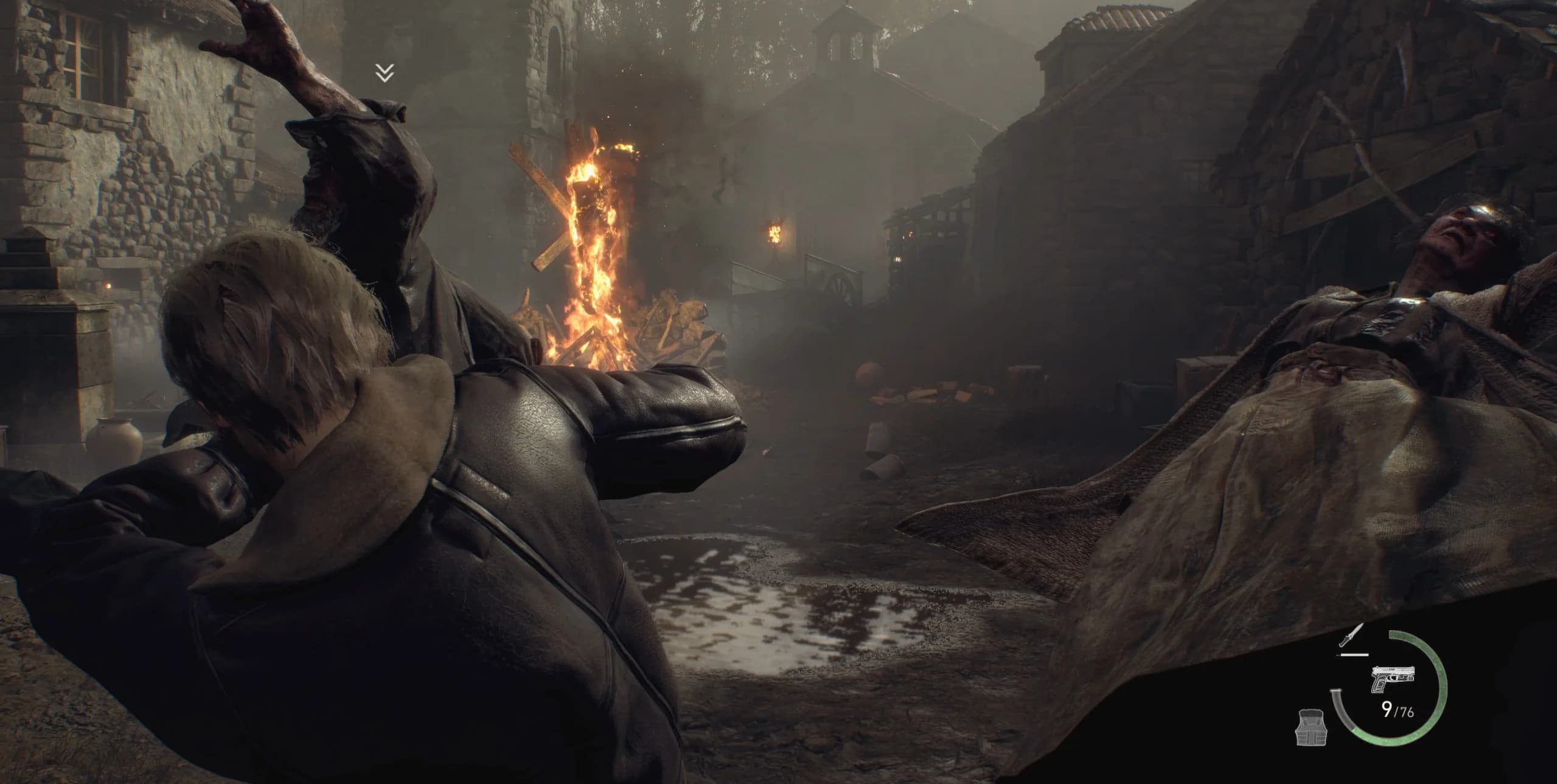Leon kicking a staggered Ganado with nearby enemies within reach.
