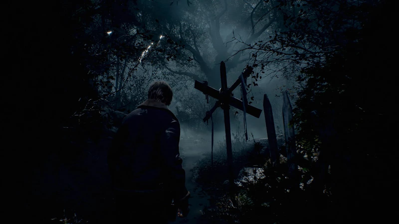 Leon on a misty woodland path in Resident Evil 4 Remake.
